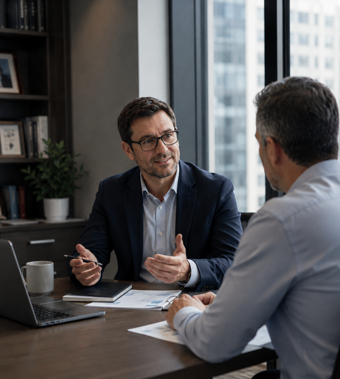 Independent insurance agent meeting with an advisor in a modern office